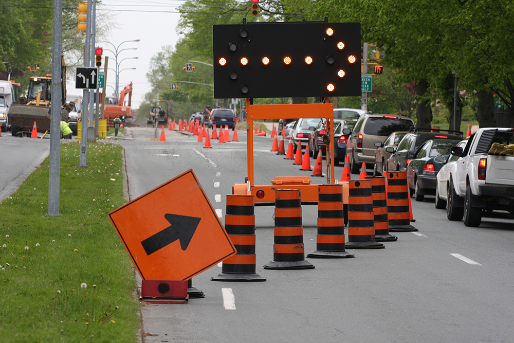 Construction contractor installing traffic infrastructure